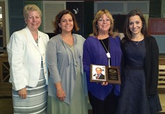 Carole Grills with her daughters and Ann King after receiving the ECADSIDA Nevins Award.